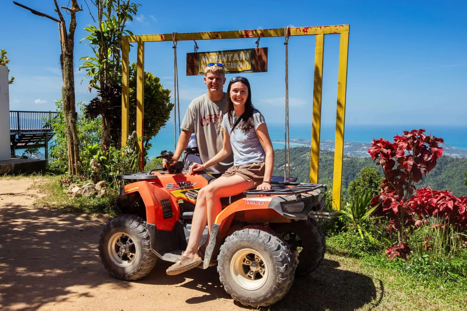 Quad bike crossing a stream on the Xplore ATV route, Koh Samui
